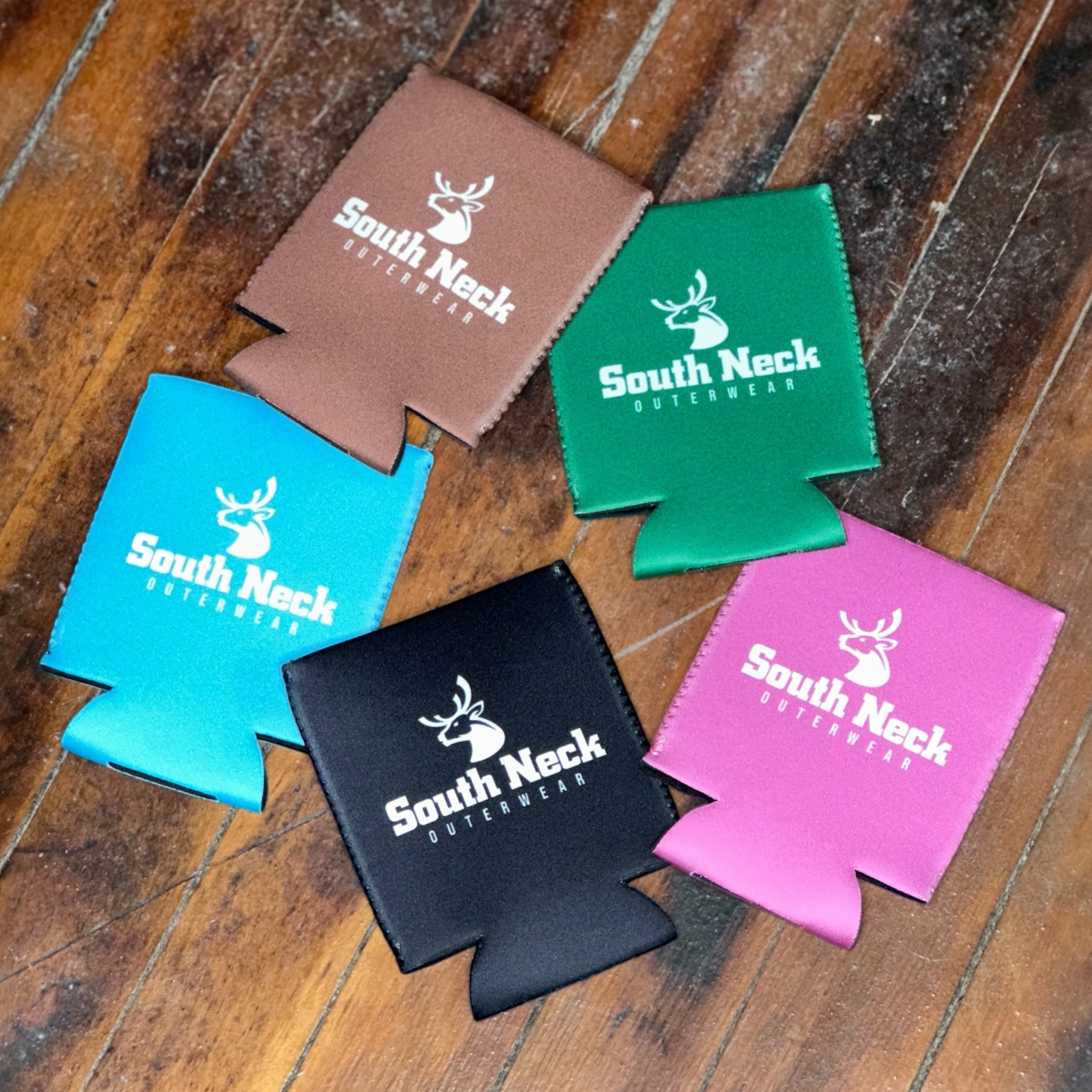 Five colorful South Neck Outerwear neoprene koozies – black, brown, green, blue, and pink drink holders with logo