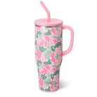 Pink and green camouflage tumbler with pink handle, lid, and straw